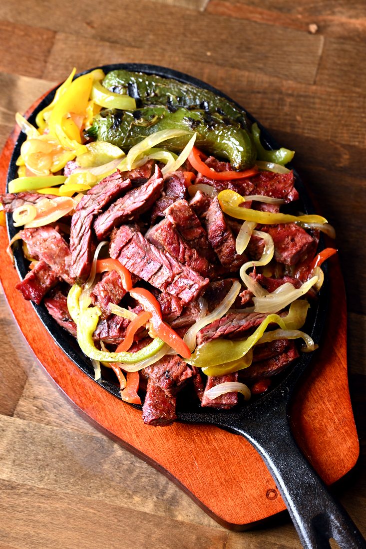 South Texas Restaurant Campaign — Fajita sizzler — bell peppers, tight and glossy.