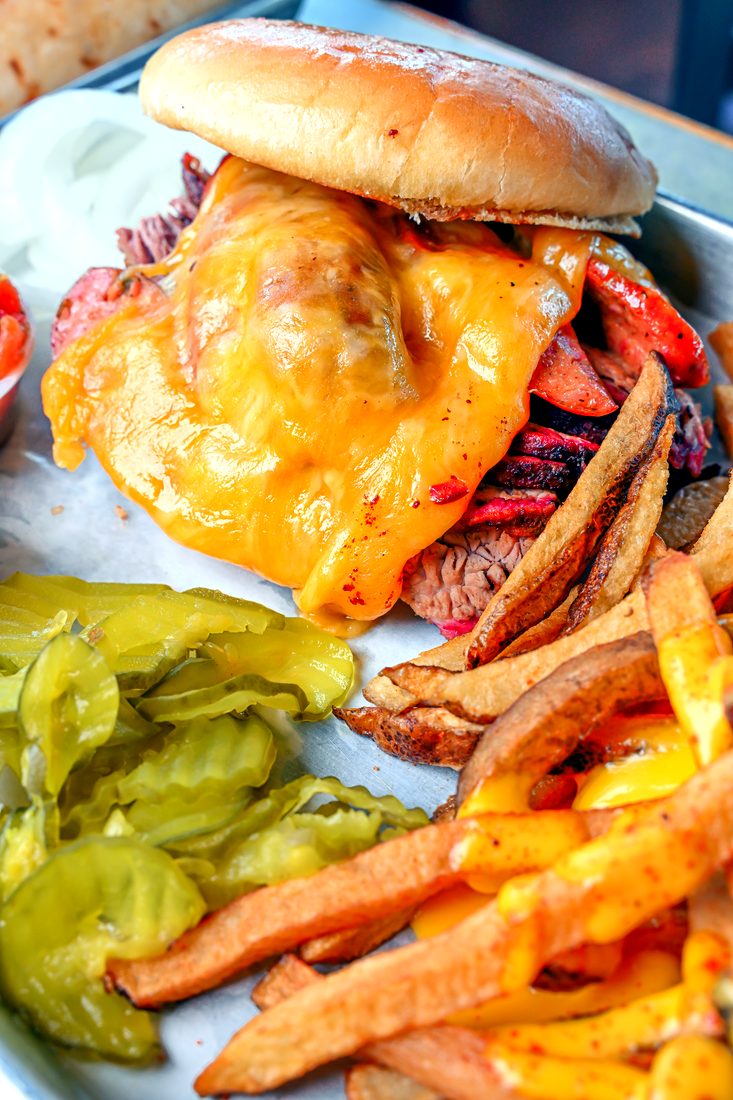 South Texas Restaurant Campaign — Melted cheese over brisket, framed close.